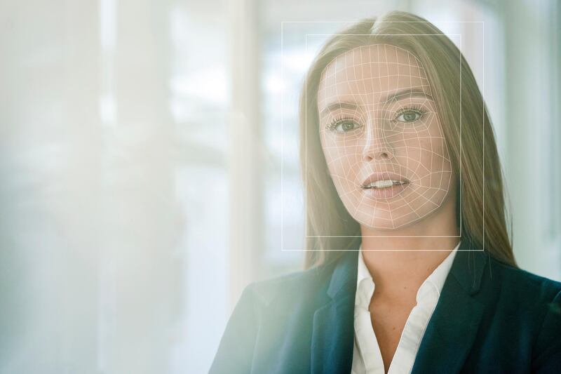 Facial recognition, businesswoman with grid over her face