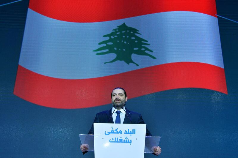 epa07369999 Lebanese Prime Minister Saad Hariri speaks during a ceremony to commemorate the 14th anniversary of the assassination of his father, late Prime Minister Rafik Hariri, in Beirut, Lebanon, 14 February 2019. The inscription on podium reading in Arabic 'The country continues with your work'. Hariri was assassinated along with 14 other people when a massive explosion hit his motorcade in Beirut, Lebanon on 14 February 2005.  EPA/WAEL HAMZEH