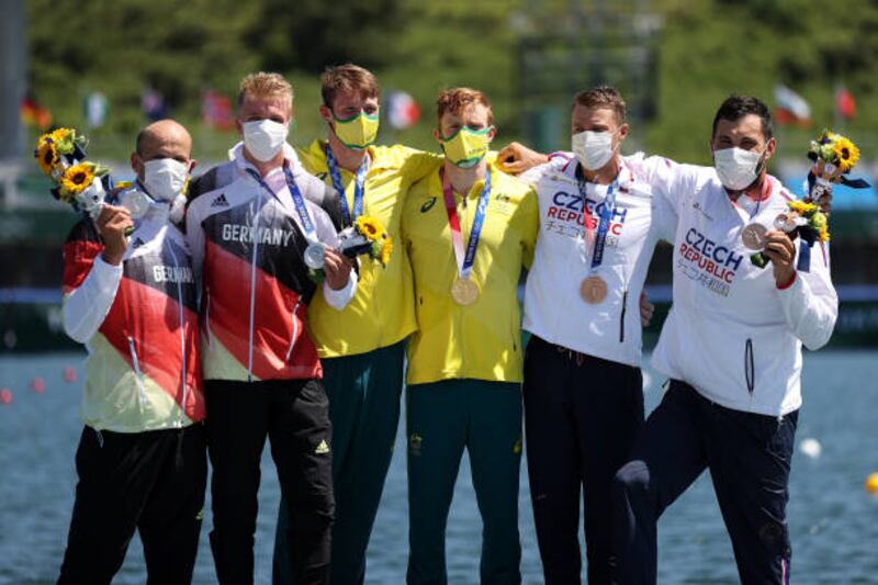 Silver medalist Max Hoff and Jacob Schopf of Team Germany, gold medalists Jean van der Westhuyzen and Thomas Green of Team Australia and bronze medalists Josef Dostal and Radek Slouf of Team Czech Republic celebrate at the medal ceremony following the Men's Kayak Double 1000m Final.