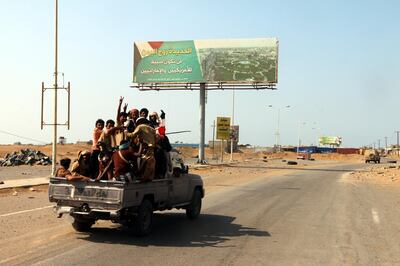 epa07221823 Yemeni pro-government forces ride a truck at a road in the port city of Hodeidah, Yemen, 10 December 2018. According to reports, UN envoy for Yemen Martin Griffiths has proposed the Houthi rebels withdraw from the government forces-besieged port city of Hodeidah on the Red Sea as part of a ceasefire deal, during the fifth day of UN-brokered peace consultations in Sweden between representatives from Yemen's internationally-recognized government and Houthi rebels. Hodeidah is the main entry for food into the Arab country.  EPA/NAJEEB ALMAHBOOBI