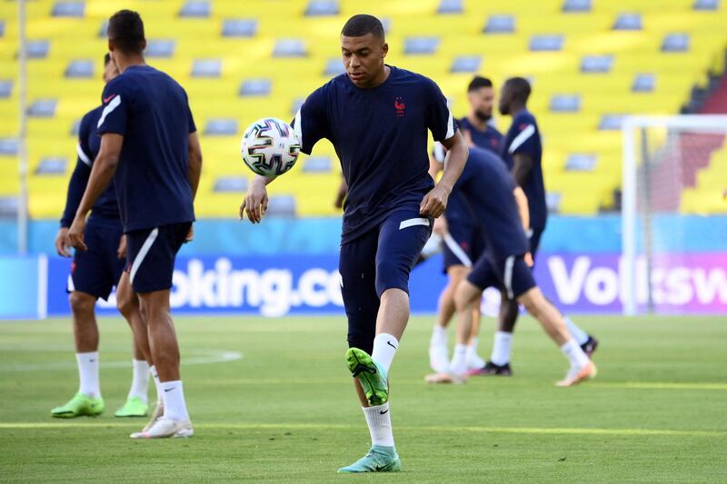 Kylian Mbappe plays with a ball during a training session at the Allianz Arena. AFP