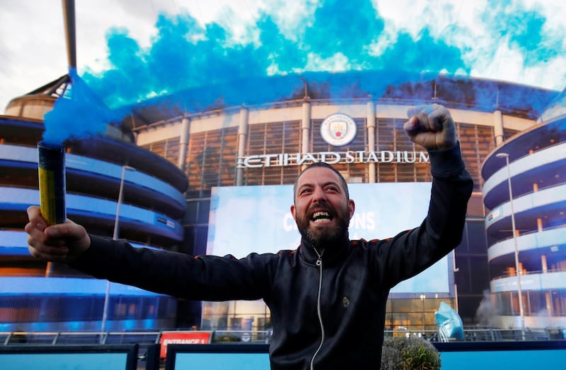 Manchester City fans celebrate winning the Premier League. Reuters