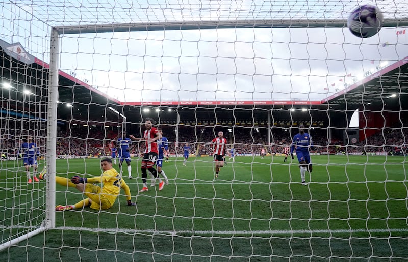Chelsea goalkeeper Djordje Petrovic is beaten as Sheffield United's Jayden Bogle scores their first goal. PA