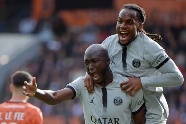 Paris Saint-Germain's Portuguese midfielder Danilo Pereira (L) celebrates with Paris Saint-Germain's Portuguese midfielder Renato Sanches (R) after scoring their team's second goal during the French L1 football match between FC Lorient and Paris Saint Germain (PSG) at Stade du Moustoir in Lorient, western France on November 6, 2022.  (Photo by JEAN-FRANCOIS MONIER  /  AFP)