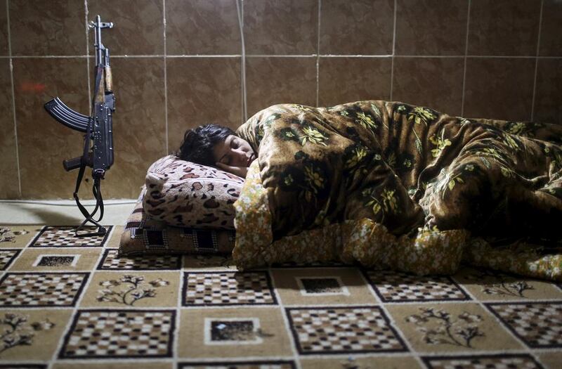 A PKK fighter sleeps at a base in Sinjar. Asmaa Waguih / Reuters