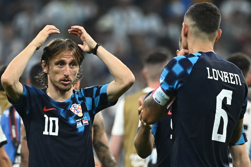 Croatia's midfielder #10 Luka Modric and Croatia's defender #06 Dejan Lovren react after losing 3-0. AFP