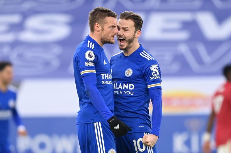 Leicester City's Jamie Vardy, left, celebrates with James Maddison  after scoring their second goal against Manchester United at King Power Stadium on Saturday. The goal was later changed to an own goal for United defender Axel Tuanzebe. AFP