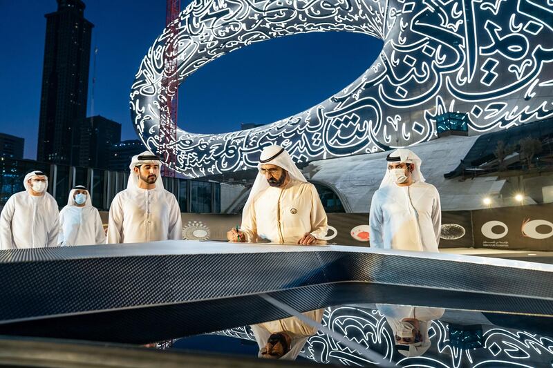 Sheikh Mohammed Bin Rashid, Vice-President and Prime Minister of the UAE and Ruler of Dubai, witnesses the installation of the final piece of façade of Museum of the Future. Seen with Sheikh Hamdan bin Mohammed bin Rashid Al Maktoum, Dubai Crown Prince and Chairman of The Executive Council of Dubai and Chairman of the Board of Trustees of Dubai Future Foundation; and Sheikh Maktoum bin Mohammed bin Rashid Al Maktoum, Deputy Ruler of Dubai. Courtesy Museum of the Future
