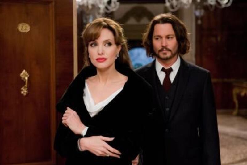 In this film publicity image released by Sony Pictures, Johnny Depp, right, and Angelina Jolie are shown in Columbia Pictures' "The Tourist." (AP Photo/Sony Pictures, Peter Mountain) *** Local Caption ***  NYET636_Film_Review_The_Tourist.jpg