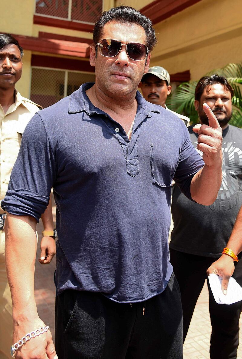 Bollywood actor Salman Khan poses for photographs after casting his vote at a polling station in Mumbai on April 29, 2019. AFP