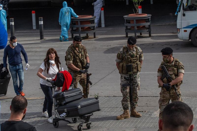 Lebanese nationals who were stranded abroad due to the coronavirus Covid-19 pandemic arrive from Cairo at Beirut international airport. EPA