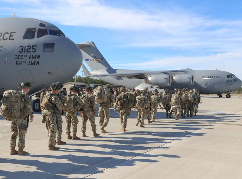 US Army paratroopers assigned to the 2nd Battalion, 504th Parachute Infantry Regiment, 1st Brigade Combat Team, 82nd Airborne Division, deploy from Pope Army Airfield, North Carolina on January 1, 2020