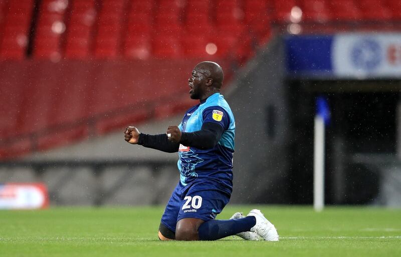 Wycombe Wanderers star Adebayo Akinfenwa celebrates after winning the League One play-off final at Wembley Stadium. PA