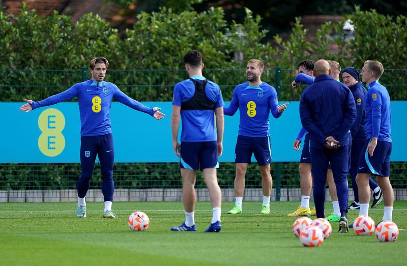 England's Jack Grealish, left, during training. PA