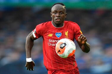 Liverpool's Senegalese striker Sadio Mane chases the ball during the English Premier League football match between Everton and Liverpool at Goodison Park in Liverpool, north west England on June 21, 2020. RESTRICTED TO EDITORIAL USE. No use with unauthorized audio, video, data, fixture lists, club/league logos or 'live' services. Online in-match use limited to 120 images. An additional 40 images may be used in extra time. No video emulation. Social media in-match use limited to 120 images. An additional 40 images may be used in extra time. No use in betting publications, games or single club/league/player publications. / AFP / POOL / PETER POWELL / RESTRICTED TO EDITORIAL USE. No use with unauthorized audio, video, data, fixture lists, club/league logos or 'live' services. Online in-match use limited to 120 images. An additional 40 images may be used in extra time. No video emulation. Social media in-match use limited to 120 images. An additional 40 images may be used in extra time. No use in betting publications, games or single club/league/player publications.