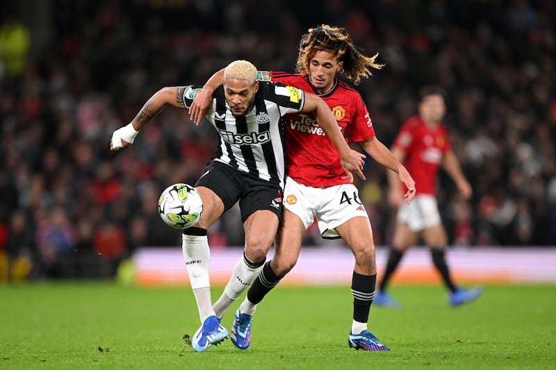 Joelinton of Newcastle United holds off Hannibal Mejbri of Manchester United during the Carabao Cup fourth round match at Old Trafford on November 01, 2023.  Getty 