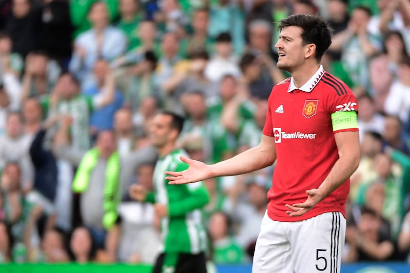 Manchester United's English defender Harry Maguire reacts during the UEFA Europa League last 16 second leg football match between Real Betis and Manchester United at the Benito Villamarin stadium in Seville on March 16, 2023.  (Photo by CRISTINA QUICLER  /  AFP)