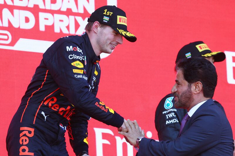 Race winner Max Verstappen is congratulated on the podium by Mohammed Ben Sulayem, FIA President. Getty