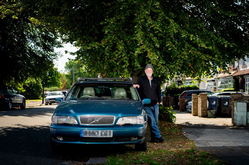 Peter McGeough, 80, a retired aircraft engineer, with his 1999 Volvo V70 in Greenford, West London. 'I've had to cancel the insurance on this car and get rid of it as I just can't afford an Ulez-compliant car'
