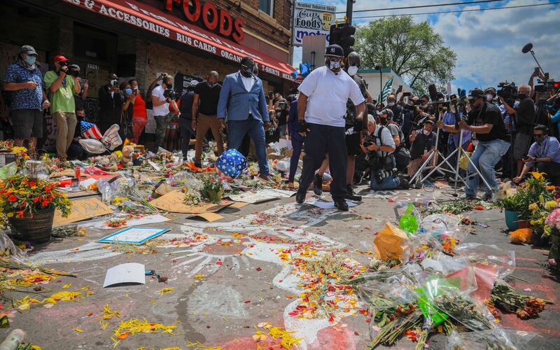 Terrence Floyd, centre, at the spot in the intersection of 38th Street and Chicago Avenue, Minneapolis, where his brother George Floyd died while in police custody, Monday June 1, 2020. AP