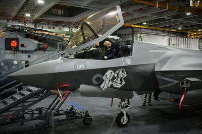 Britain's Prime Minister Boris Johnson sits in the cockpit of an F-35 Lightning II during a visit to the 'HMS Queen Elizabeth' aircraft carrier, in May 2021.  Getty Images