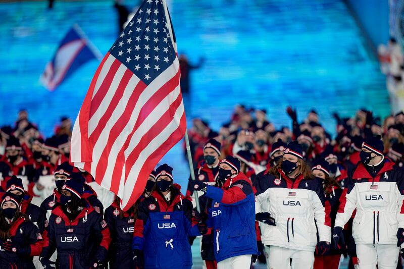 American speed skater Brittany Bowe and curler John Shuster lead their team during the opening ceremony. AP