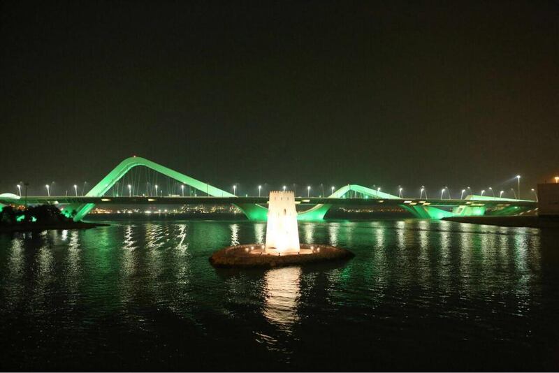 Sheikh Zayed Bridge is light up with green lights to celebrate Saudi National Day. Wam