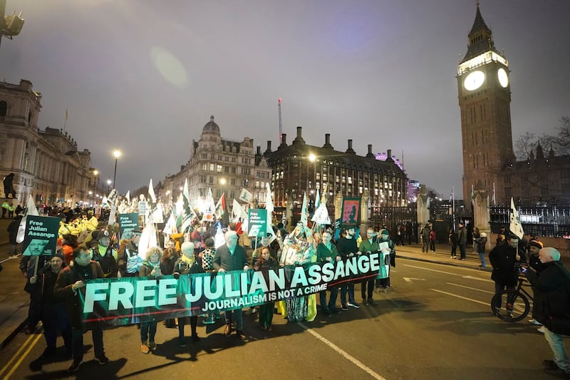 Campaigners pressing for the release of WikiLeaks founder Julian Assange take part in a demonstration during a Night Carnival in Parliament Square, London. AP.