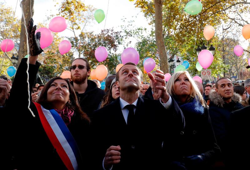 On November 13, 2017, French President Emmanuel Macron, his wife Brigitte Macron and Paris Mayor Anne Hidalgo released balloons at the 11th district town hall in Paris. AFP