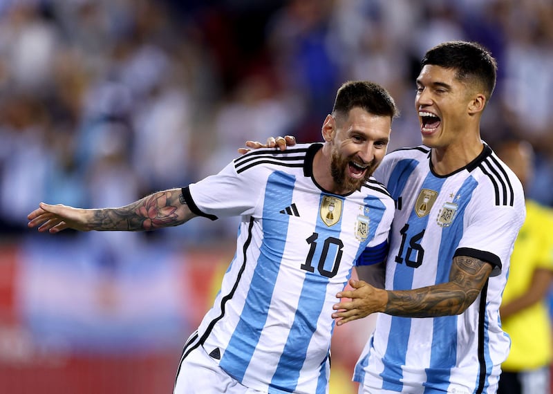 Lionel Messi celebrates with teammate Joaquin Correa after scoring during Argentina's 3-0 win against Jamaica at the Red Bull Arena in New Jersey on Tuesday, September 27, 2022. AFP