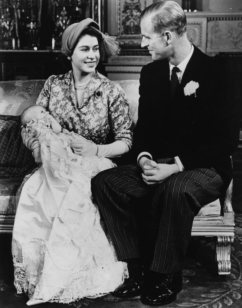 Portrait of Princess Elizabeth and Prince Philip with their baby daughter Princess Anne following her christening, at Buckingham Palace, October 23rd 1950. (Photo by Fox Photos/Hulton Archive/Getty Images)
