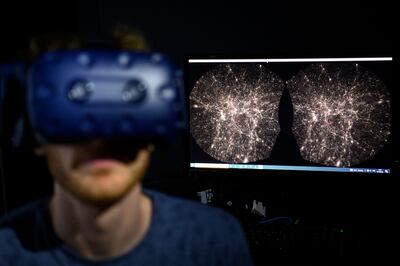 A software engineer explores a detailed 3D map of the universe with the virtual reality software VIRUP, developed by the Swiss Federal Institute of Technology. AP