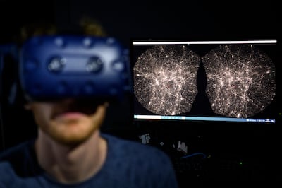 A software engineer explores a detailed 3D map of the universe with the virtual reality software VIRUP, developed by the Swiss Federal Institute of Technology. AP