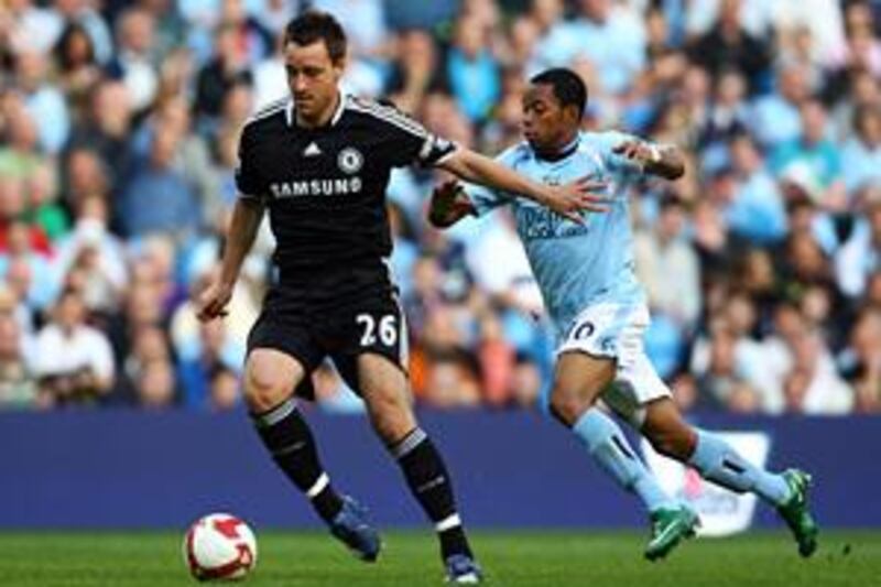 Chelsea's John Terry, left, in action against Manchester City last season. Today the Blues confirmed they had rejected a second bid for their captain from City.