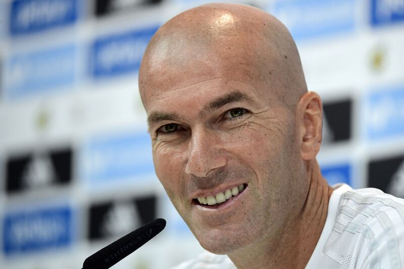 Real Madrid's French coach Zinedine Zidane smiles during a press conference at Real Madrid sport city in Madrid on August 12, 2017, on the eve of the Spanish SuperCup first leg football match Real Madrid CF vs FC Barcelona. / AFP PHOTO / JAVIER SORIANO