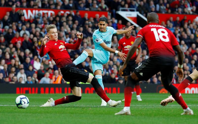 Newcastle United's Ayoze Perez has a shot at goal as Manchester United's Scott McTominay attempts to block. Reuters