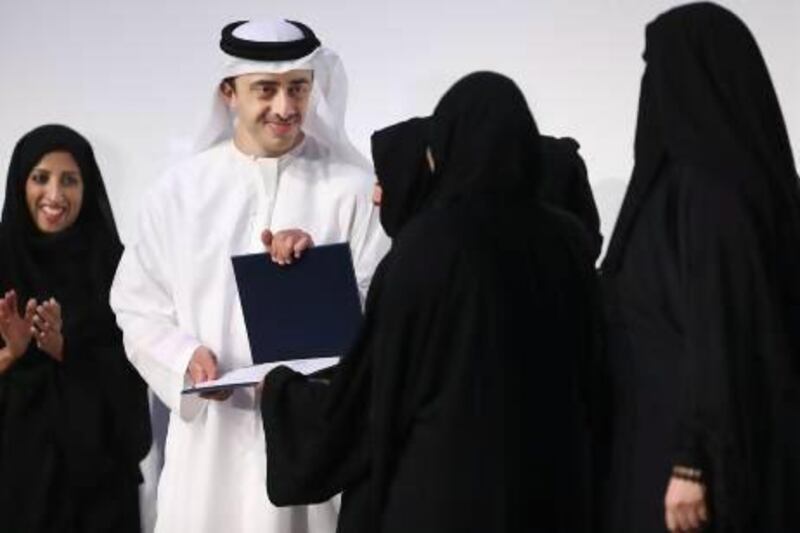 Sheikh Abdullah bin Zayed, Minister of Foreign Affairs and Chairman of the Emirates Foundation for Youth Development, presents prizes yesterday to winners of the foundation’s Think Science Awards, which aim to help “explore Emirati science talent at a young age”. Delores Johnson / The National