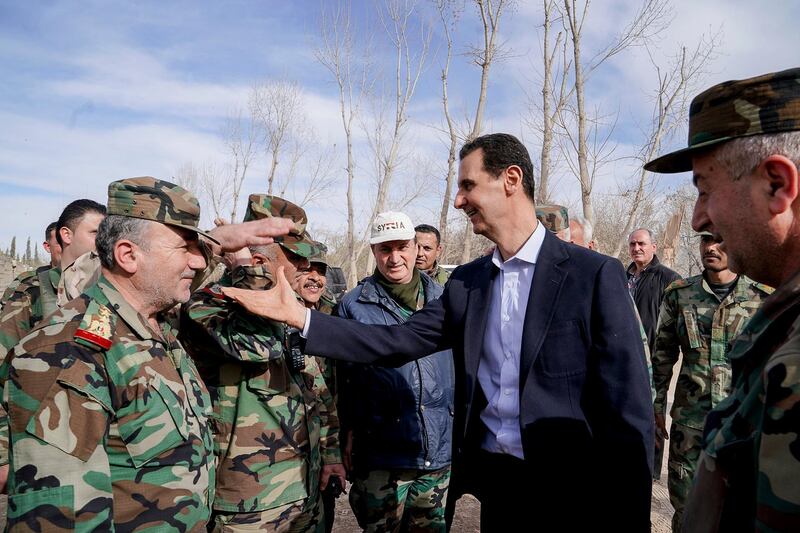 Syrian President Bashar Al Assad meets soldiers in eastern Ghouta. The Syrian army, which is carrying out a ground offensive in the region, claimed it had captured 70 per cent of the rebel-held enclave of eastern Ghouta. EPA