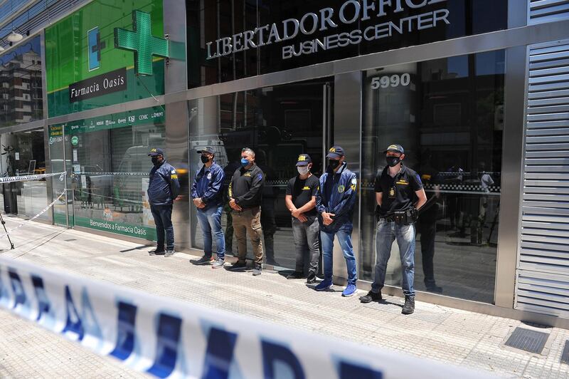 Members of the Argentinian Police outside the office of Diego Maradona's personal doctor, in Buenos Aires. EPA