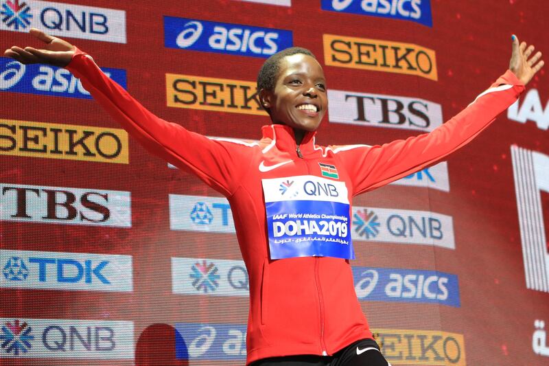 Bronze medallist Kenya's Agnes Tirop poses on the podium during the medal ceremony for the Women's 10,000m at the 2019 IAAF World Athletics Championships at the Khalifa International Stadium in Doha. AFP