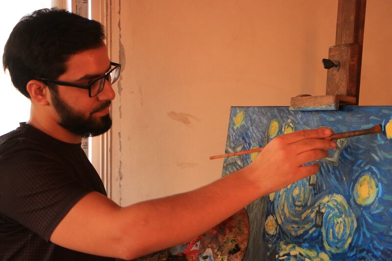 Al Shami drawing in his studio. Abd Almajed Alkahr/The National