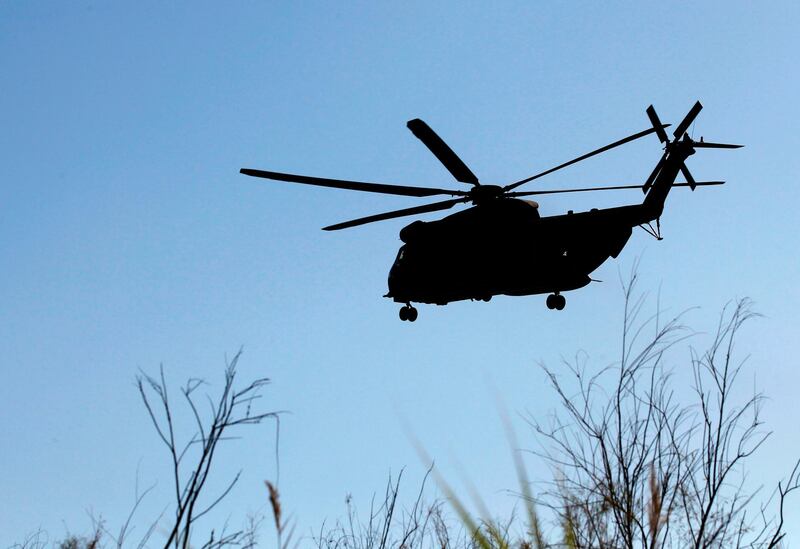 A Sikorsky CH-53K King Stallion helps searching the Sea of Galilee coasts for remains of a reported drone launched from Syria and intercepted by a Patriot missile on July 11, 2018, near the Ha-On kibbutz, northeastern Israel. Israel intercepted a drone launched from Syria with a Patriot missile on Wednesday, setting off sirens in the occupied Golan Heights, the army said. "UAV from Syria intercepted by Patriot missile, causing sirens in Golan and Emek HaYarden Regional Councils," an army statement said. The Emek HaYarden region is located southwest of the Golan, near Syria. / AFP / JALAA MAREY
