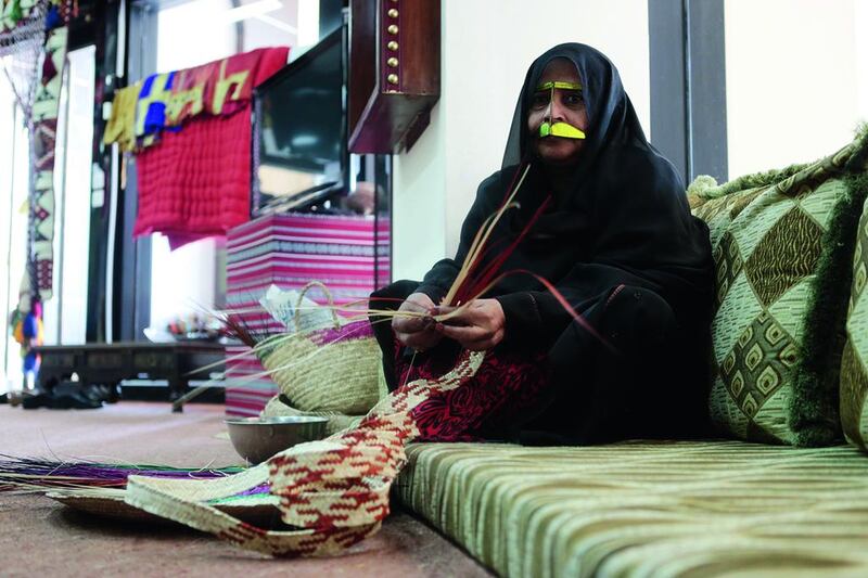 Haleema Ali Al Shehhi, who weaves palm fronds at the National Theatre in Abu Dhabi. Christopher Pike / The National