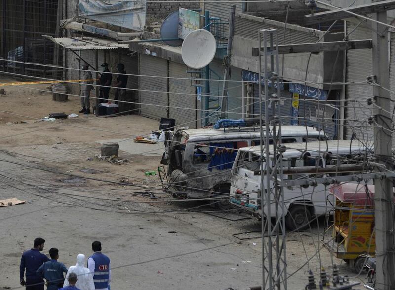 A Pakistani forensic team arrives at the scene of a suicide bomb attack on a census team in Lahore on April 5, 2017. Arif Ali / AFP

