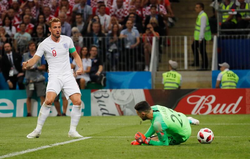 Harry Kane  sees his shot saved before he hits the rebound against the post in the first half. EPA