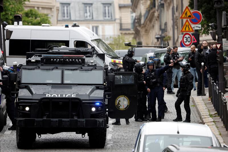 French police secure the area near the Iran consulate in Paris on April 19, after a man who had threatened to blow himself up was arrested. Reuters