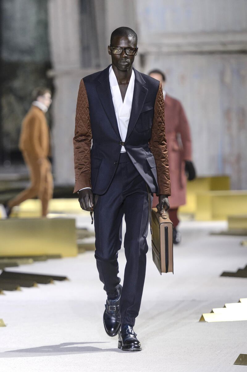 Ermenegildo Zegna: A suit is overhauled with quilted contrasting sleeves and a toggle fastening. Replacing the shirt with a crisp V-neck top makes it that little bit more unexpected. Courtesy Zegna