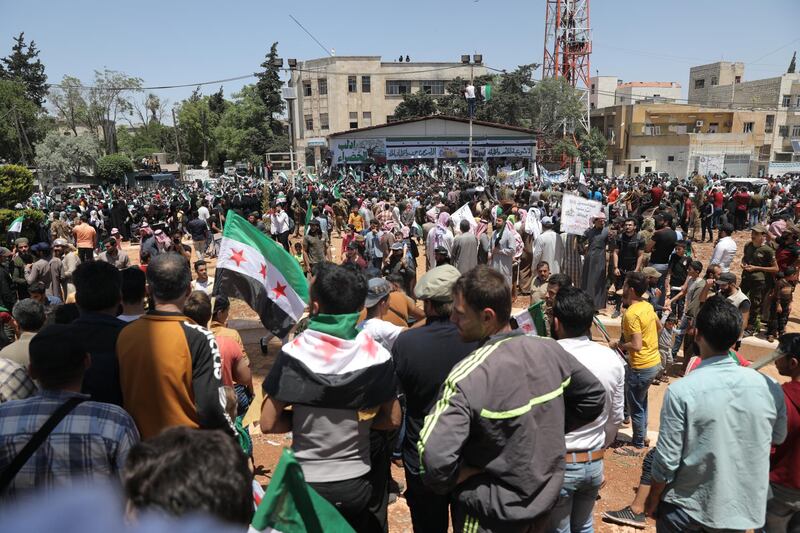 People gathered to protest on the same day of voting in the presidential elections that is being held in the government-controlled provinces, while no vote is being held in the rebels-controlled northwestern Idlib province. EPA