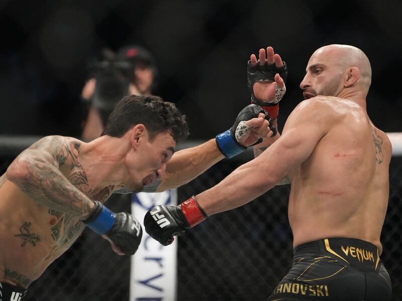 Alexander Volkanovski and Max Holloway in action during their bout at UFC 276. Reuters