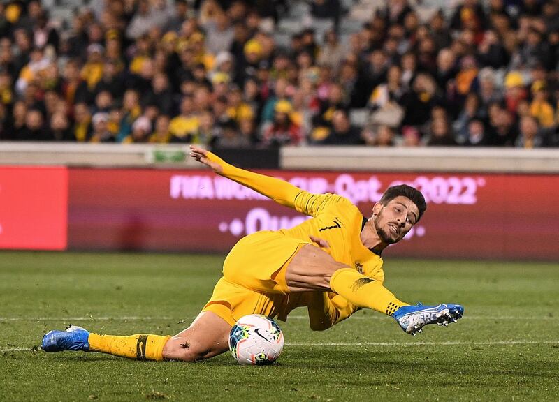 Mathew Leckie of Australia slips whilst taking a shot during the World Cup qualifier against  Nepal in Canberra, on Thursday, October 11. Reuters